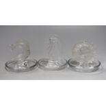 Three Lalique trinket dishes with central figures of a mermaid, a fish and a swallow, highest 10.