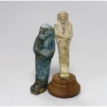 Two Egyptian glazed faience ushabti, one on wooden base, 9.6cm high. Provenance - collected before