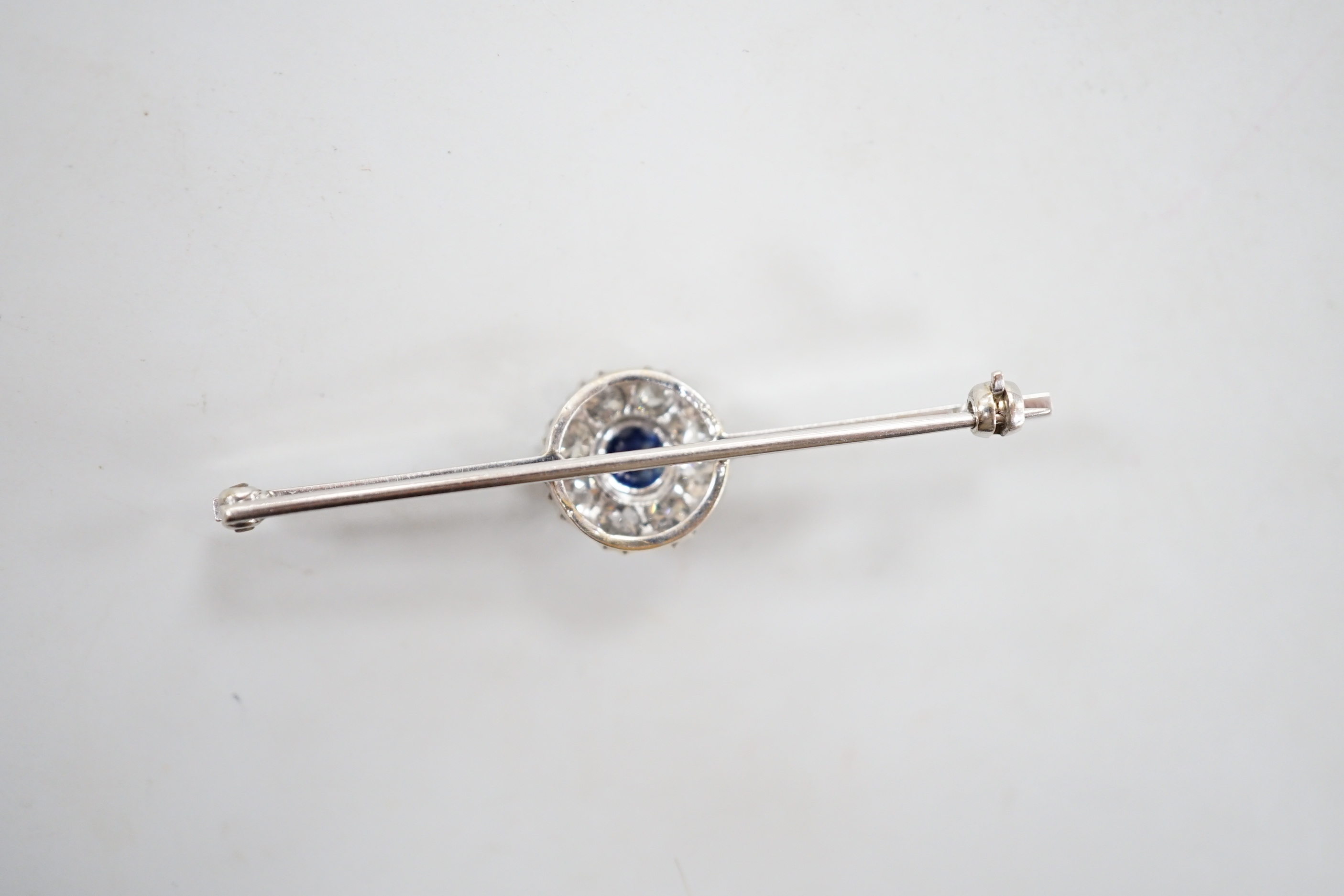 A mid 20th century white metal, sapphire and diamond cluster set bar brooch, 55mm, gross weight 4. - Image 4 of 4