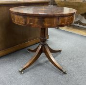 A George III style circular mahogany drum table with segmented veneered top, diameter 76cm, height