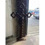 A Victorian Gothic style cast iron cross on rectangular plinth foot, width 96cm, height 184cm