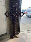 A Victorian Gothic style cast iron cross on rectangular plinth foot, width 96cm, height 184cm