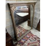 A Victorian giltwood and composition overmantel mirror, repainted, width 124cm, height 134cm