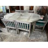 An Alexandra Rose weathered teak octagonal garden table, length 210cm, width 122cm, height 74cm, a