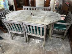 An Alexandra Rose weathered teak octagonal garden table, length 210cm, width 122cm, height 74cm, a