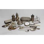 Assorted small silver items including a toastrack, peppers, flatware, mounted penknife, pocket