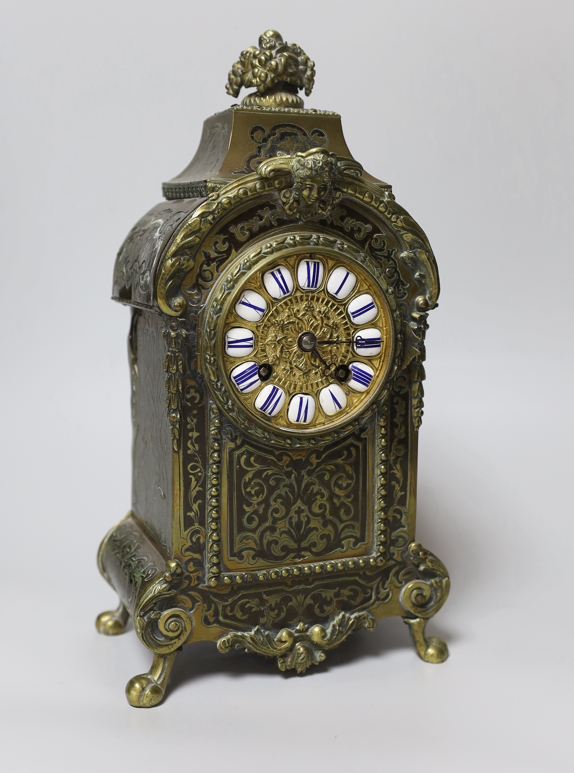 A late 19th century French brass boullework mantel clock, with key and pendulum, 30cm high