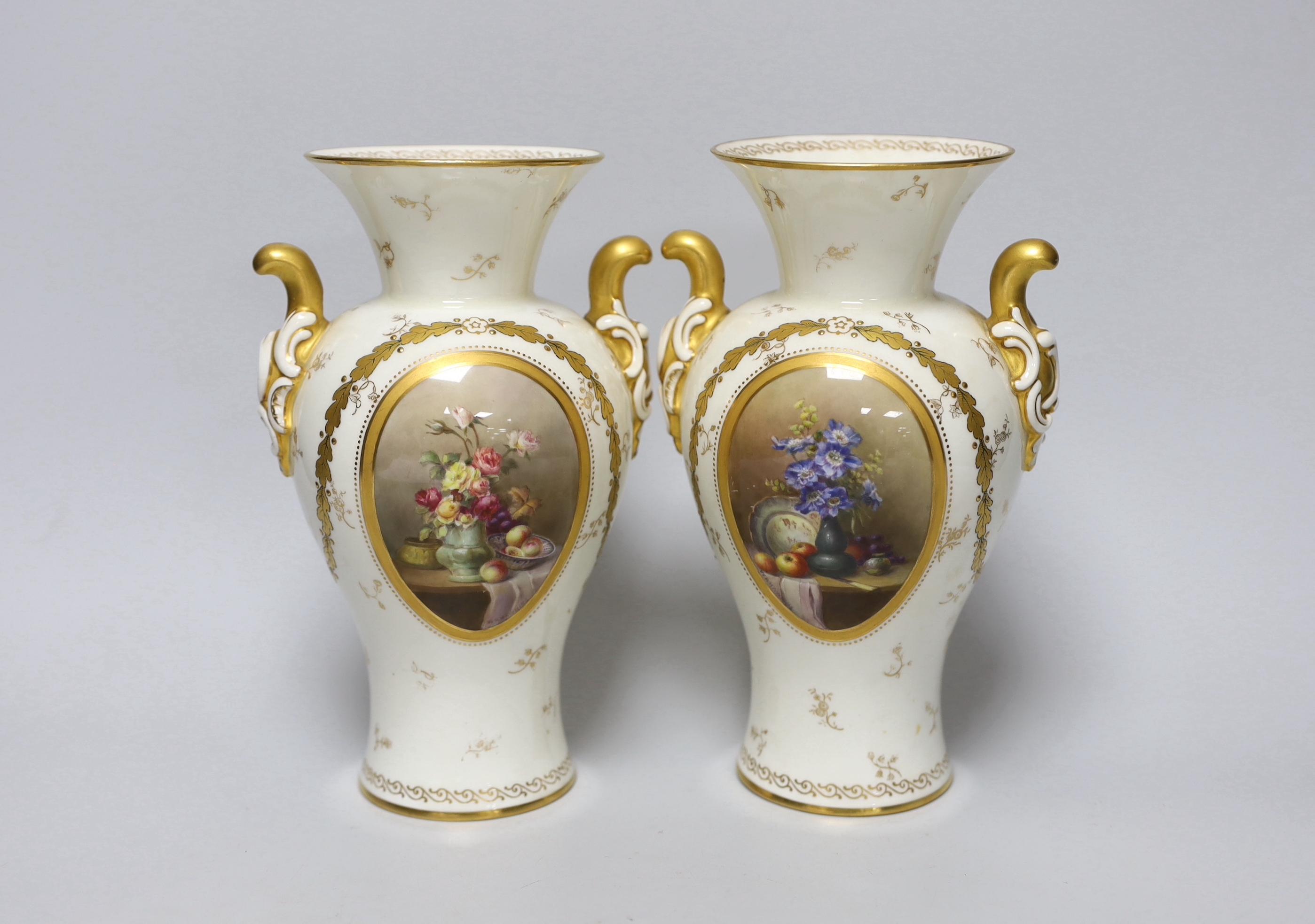 A pair of Royal Worcester vases with gilded decoration and still life panels signed W A Hawkins,