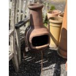 A chiminea on a stand, height 88cm