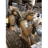 A pair of carved pine angels playing recorders, height 40cm