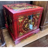 A modern Chinese red lacquer square painted trunk, 47cm, height 44cm