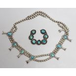 A South American? white metal and turquoise set necklace, 66cm and a similar brooch.