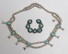 A South American? white metal and turquoise set necklace, 66cm and a similar brooch.