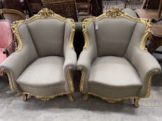 A pair of Louis XVI style carved giltwood and composition upholstered armchairs, width 85cm, depth