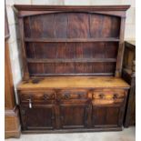 An 18th century provincial oak and elm dresser with associated boarded rack, length 163cm, depth