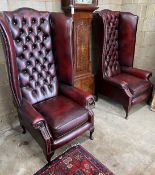 A pair of Victorian style buttoned burgundy leather high back wing armchairs, width 80cm, depth