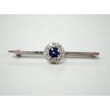 A mid 20th century white metal, sapphire and diamond cluster set bar brooch, 55mm, gross weight 4.