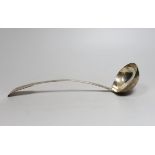 An early 19th century Irish? silver fiddle pattern soup ladle, makers mark RH (stamped twice)
