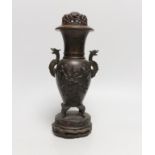 A Japanese bronze twin handled vase together with a Chinese pierced and carved hardwood cover and
