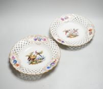 A pair of Meissen outside decorated bird and flower dishes, 23cm diameter