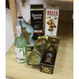 Four assorted bottles of whisky including a Bells Statue of Liberty, and a bottle of Ron Bacardi