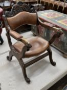 An early 20th century oak tan leather folding prayer chair, width 59cm, depth 62cm, height 90cm