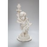 An English white glazed porcelain Bacchanalian fawn candlestick, possibly Moore Brothers, 39cm high