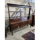 An 18th century oak dresser, with open rack and three frieze drawers, width 180cm, depth 46cm,