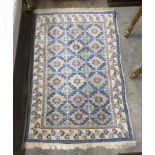 A Caucasian blue ground rug, 142 x 98cm