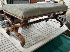 A late Victorian Aesthetic movement walnut X frame window seat, width 115cm, depth 48cm, height