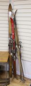 Three pairs of 1950's wooden skis, each with a pair of bamboo poles by Hickory-Sole, Derby, Sport-