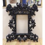 A large black painted gothic style picture frame, aperture 42.5cm x 27cm