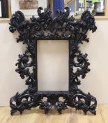 A large black painted gothic style picture frame, aperture 42.5cm x 27cm