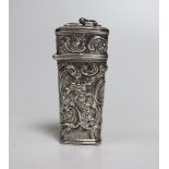 A 19th century continental embossed white metal etui, (lacking almost all implements), 88mm.