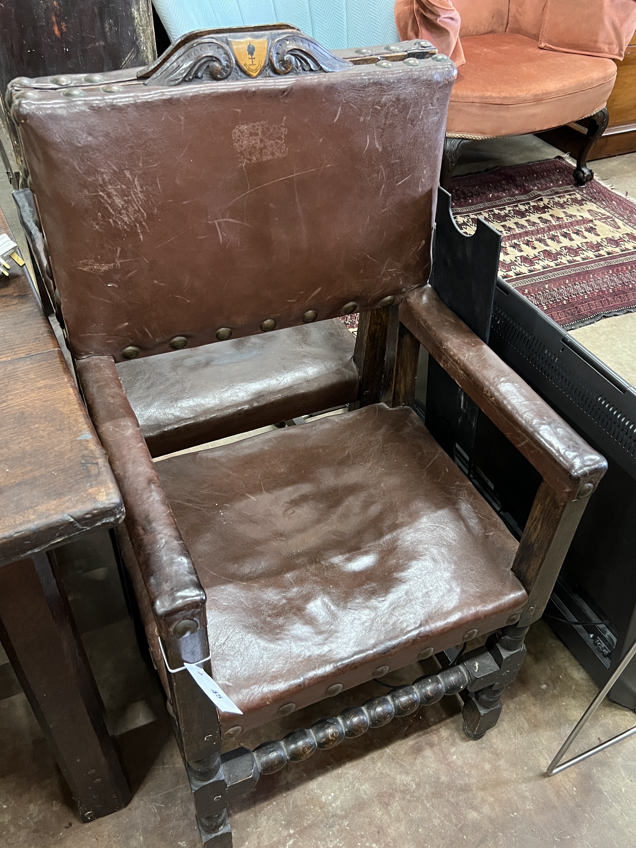 A set of eight 1920’s 17th century style oak dining chairs, the carvers with crested top rails