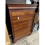 A reproduction French style cherry wood seven drawer semainier, width 99cm, depth 47cm, height