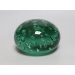 A green glass dump weight, 14cm in diameter