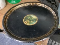 A Victorian toleware tray with transfer cartouche of children playing with model boats, width 60cm