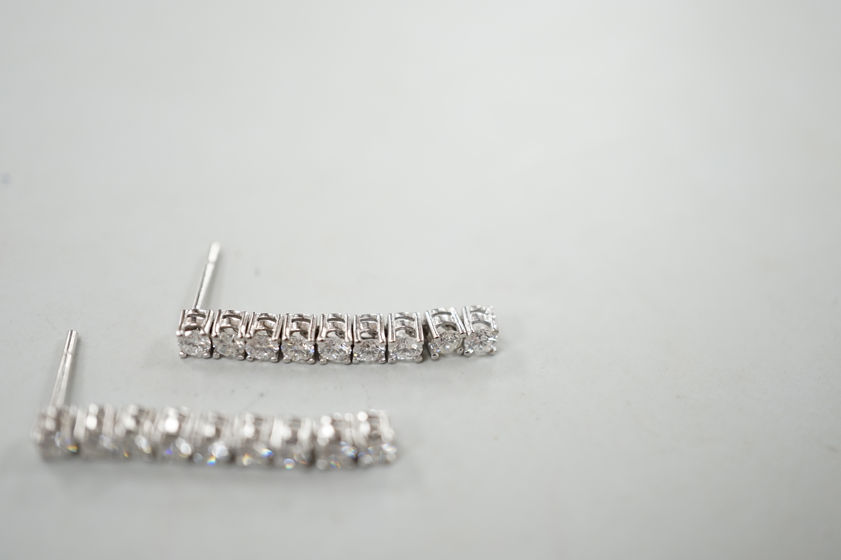 A modern pair of white metal and nine stone diamond set line drop earrings, with 925 butterflies, - Image 3 of 5