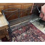 A painted wrought iron garden bench, length 166cm, depth 45cm, height 91cm