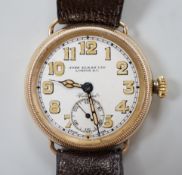 A gentleman's early 20th century yellow metal manual wind wrist watch, retailed by John Elkan Ltd,