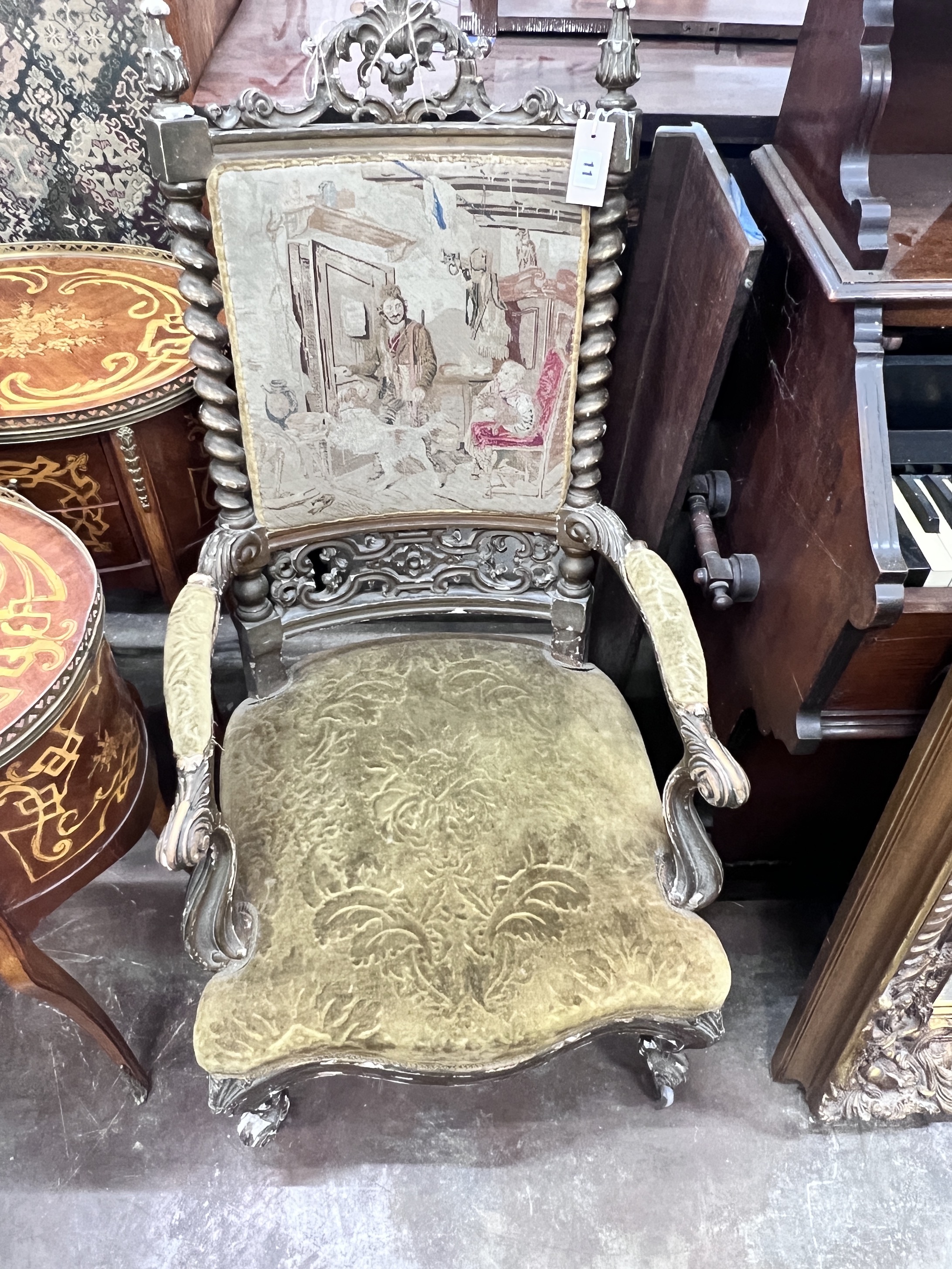 A Victorian carved giltwood and composition tapestry back open armchair, width 54cm, depth 56cm,