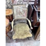 A Victorian carved giltwood and composition tapestry back open armchair, width 54cm, depth 56cm,