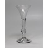 An English lead crystal ‘kit kat’ balustroid wine glass, c.1740, three-piece drawn trumpet, the