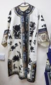 A late 19th/early 20th century Chinese embroidered cream silk robe with black symbolic embroidered