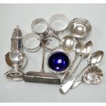 Sundry small silver including a George V pepperette, four silver napkin rings, a silver mounted