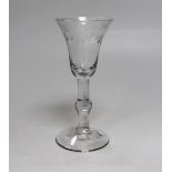 An English lead crystal balustroid wine glass, c.1740, the bowl is of flared trumpet form with the