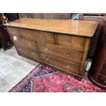 A reproduction mahogany military style dresser fitted seven small drawers, with recessed brass