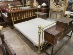 A Victorian style super kingsize tubular brass bedstead, with box base, length approx. 220cm,
