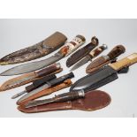 Eight knives including hunting knives, and bone handled Kukri example, the largest 42cm in length